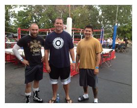 Lou Storiale with fighters at an Illinois boxing tournament